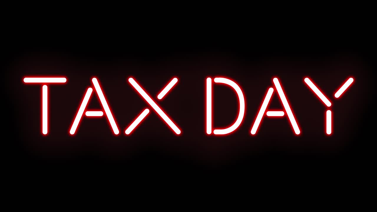 Insegna al neon rossa del Giorno delle Tasse che sfarfalla