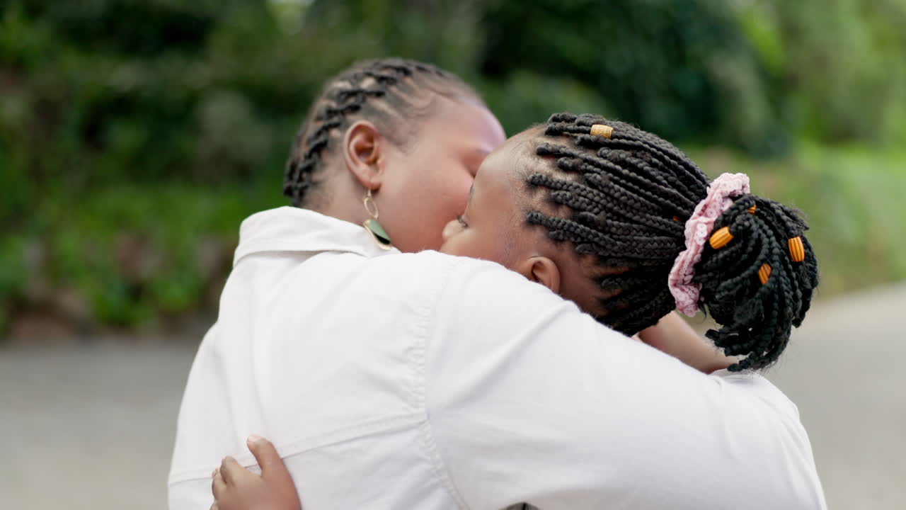 Black woman, hug and daughter with love at park