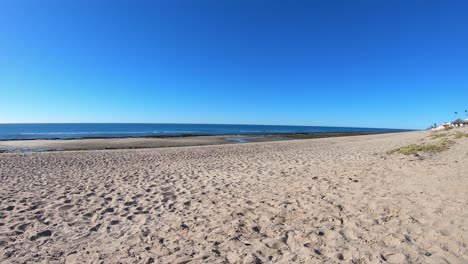 Time-lapse-of-the-sandy-beach-and-ocean-waves-at-Las-Chochas,-Puerto-Peñasco,-Gulf-of-California,-Mexico