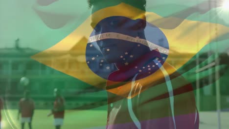 animation of flag of brazil over diverse male rugby players