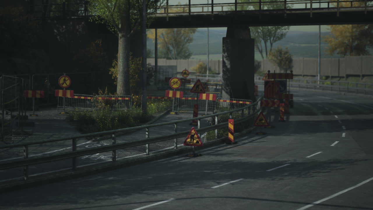 Road construction activity near a bridge in a rural area during the day