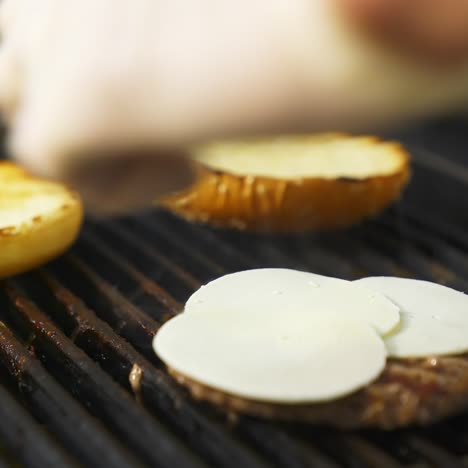 grilled meat cutlets on metal grill. cooking meat and patties for hamburger. beef or pork cutlet grilling on grid