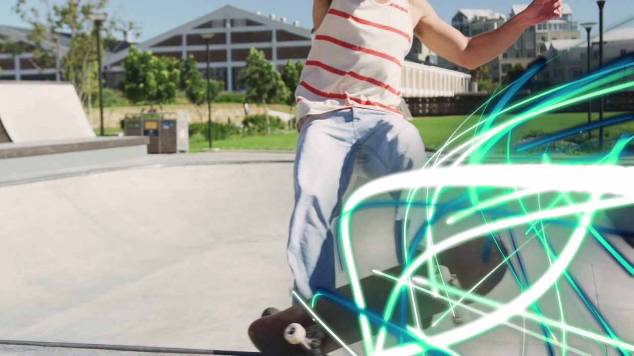 Male skater pumping carving bowl, gaining speed as front foot crossing lip making neon trail sports