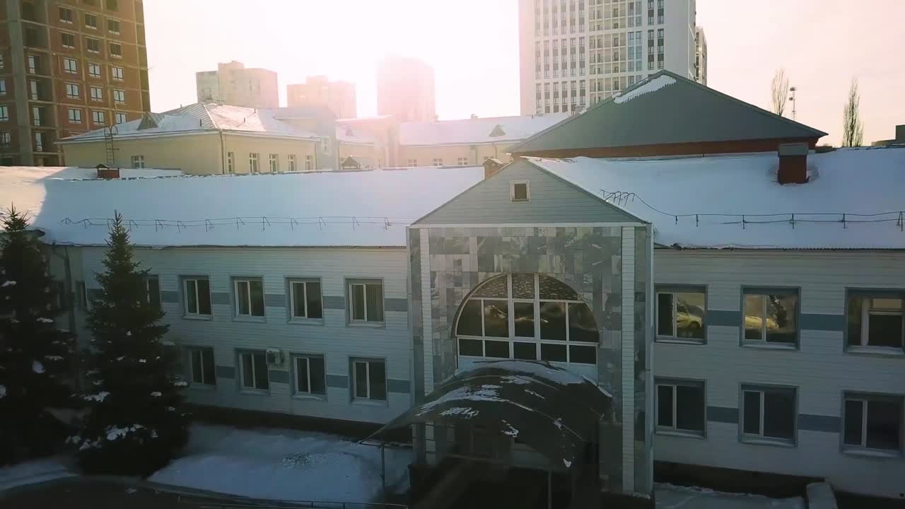 Snowy Cityscape with Residential and Commercial Buildings