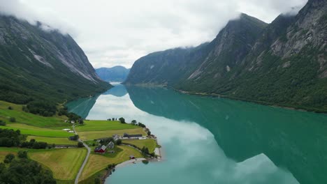 norway scenic fjord and turquoise blue jolstravatn lake in sygnesand, sunnfjord, vestland - aerial circling