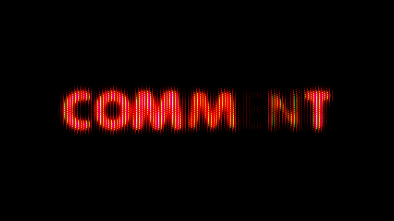 Red Pixelated 'COMMENT' Text Flickering on Black Background
