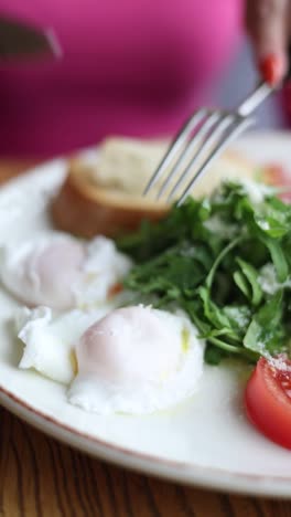 poached eggs with salad and toast