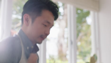 happy-asian-family-dancing-in-kitchen-father-enjoying-dance-with-daughter-little-girl-laughing-enjoying-exciting-weekend-at-home-4k-footage