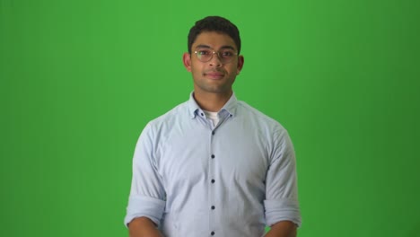 Male-Signer-Saying-Good-Night-In-Ecuadorian-Sign-Language-Against-Green-Background