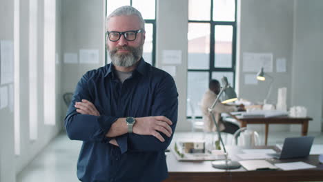 Portrait-of-Senior-Male-Architect-Posing-with-Confidence-in-Office