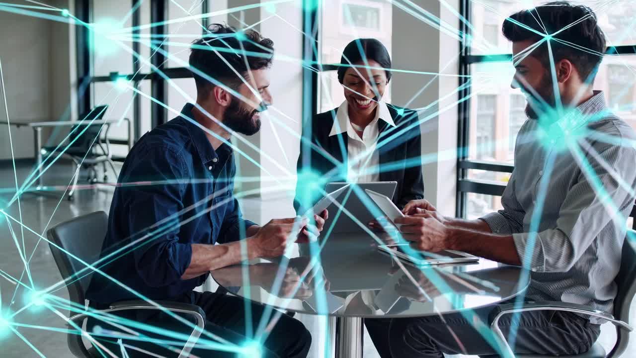 High-angle video of three professionals at a round table with digital network overlay
