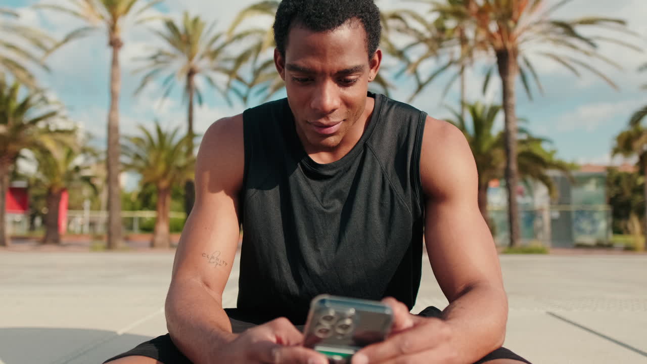 Man Checking Phone After Fitness Workout
