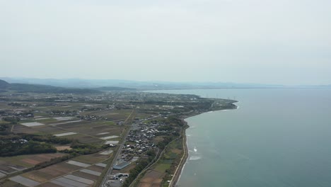 Aerial-pan-of-sea-of-Japan-along-Tottori-Prefecture-with-Shimane-in-the-distance