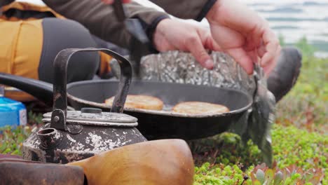 People Cooking Meat Patties In The Meadow Of Norway