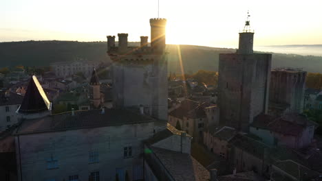 flying along the castle of uzes the duchy sunrise france gard beautiful old