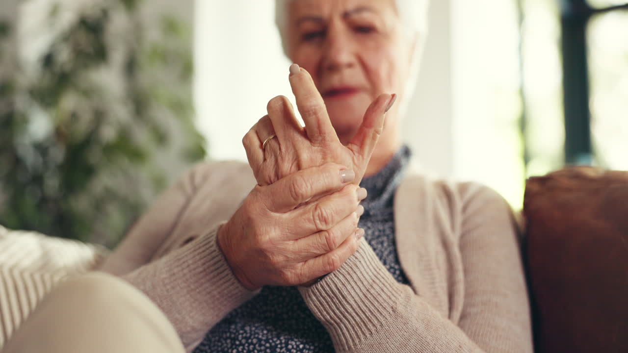 Elderly woman suffering from arthritis pain