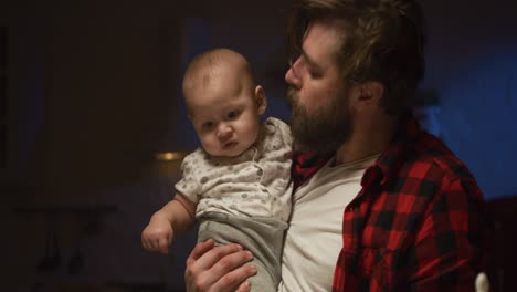 father and baby feeding time