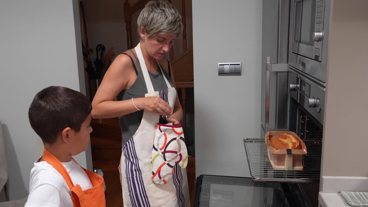Woman and Boy Baking in Kitchen