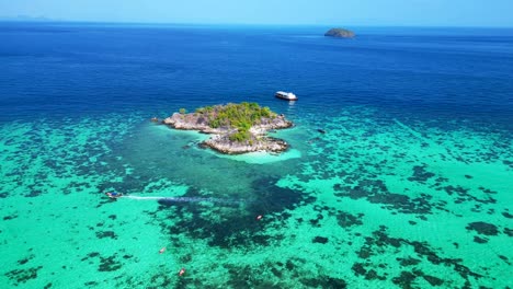 beach rocky cliff island turquoise blue sea