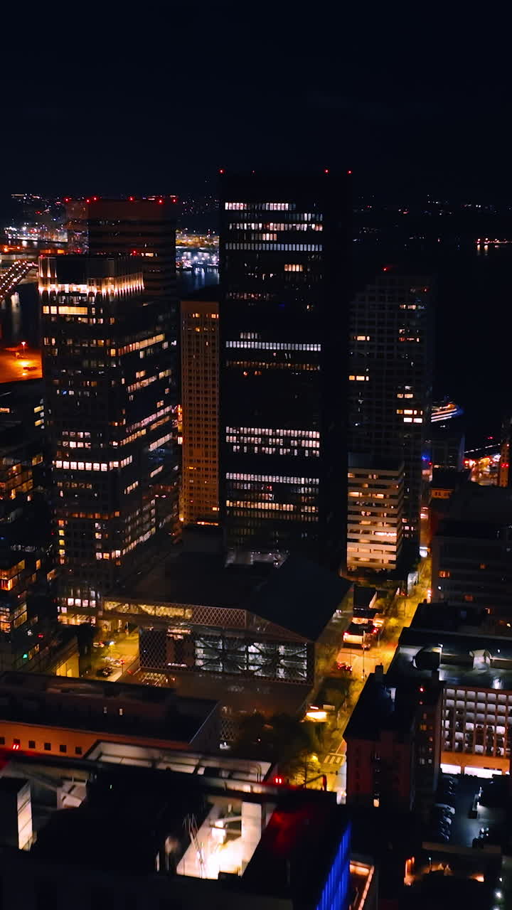 New York city in summer night. Aerial shot of american city building in night. Vertical video