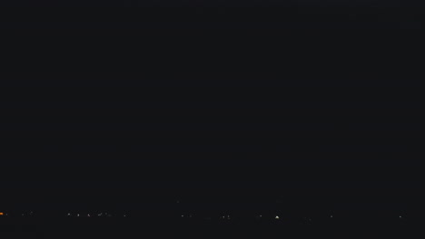 bright bolt of lightning streaks across the night sky slow motion