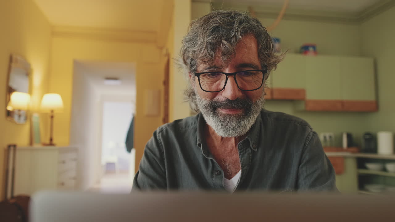 Man working on a computer at home