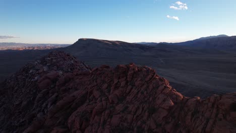 aerial-scenic-landscape-red-rock-formation-in-Las-Vegas,-drone-flu-above-the-canyon-during-golden-hours