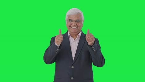 happy indian senior manager showing thumbs up green screen