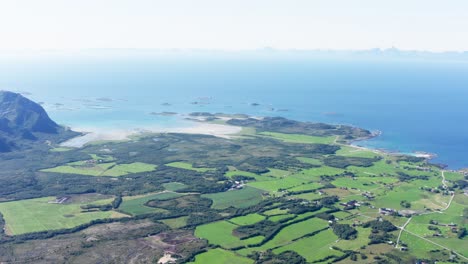 aerial view of green landscape in engeloya near recreational area of bosanden in steigen, nordland county, norway