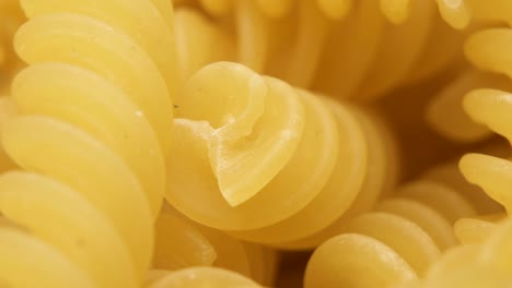 macro shot of spiral shaped pasta. italian fusilli pasta, macaroni