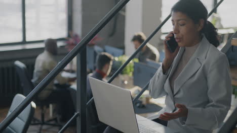 businesswoman on stairs in modern office