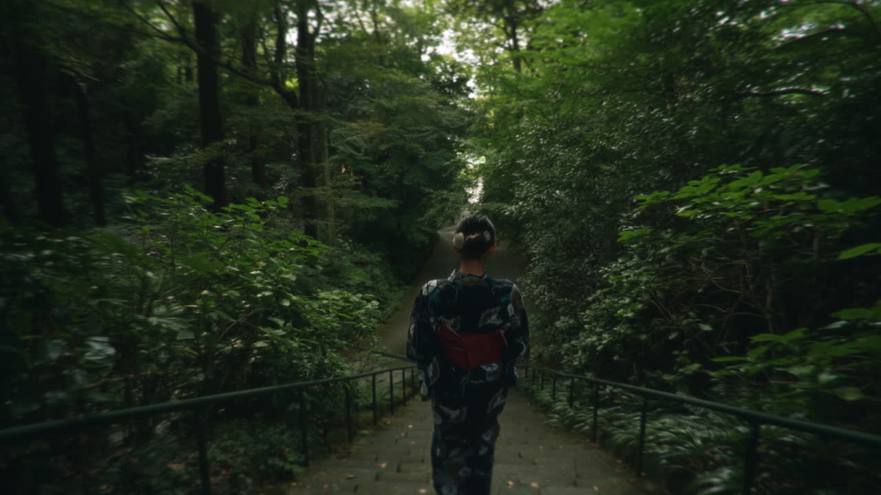 Woman in Kimono Walking Through Forest