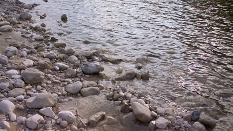 rocky riverbank in the evening sun