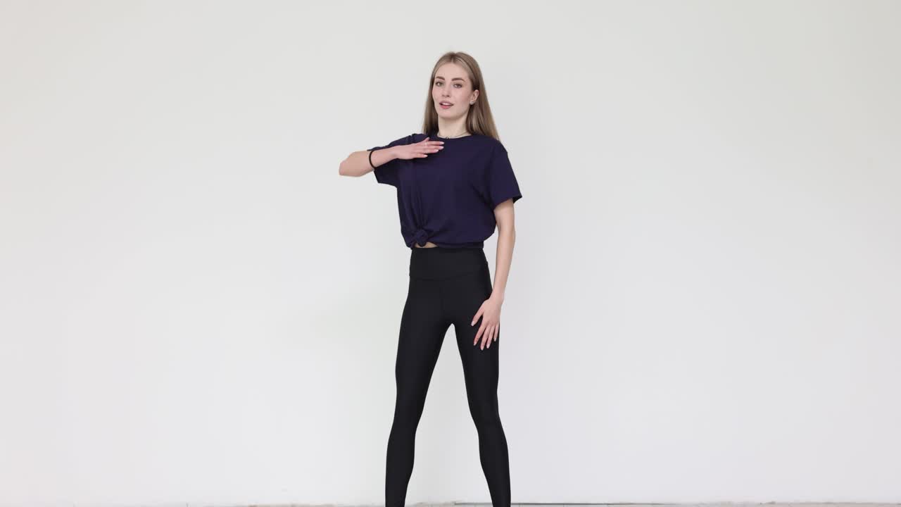 Young Woman in Athletic Wear Against White Background