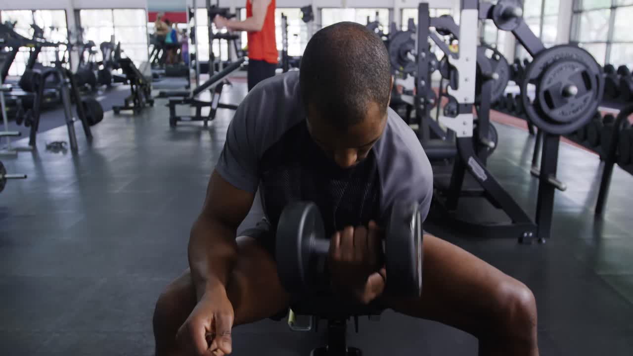 Working out with weights at a gym