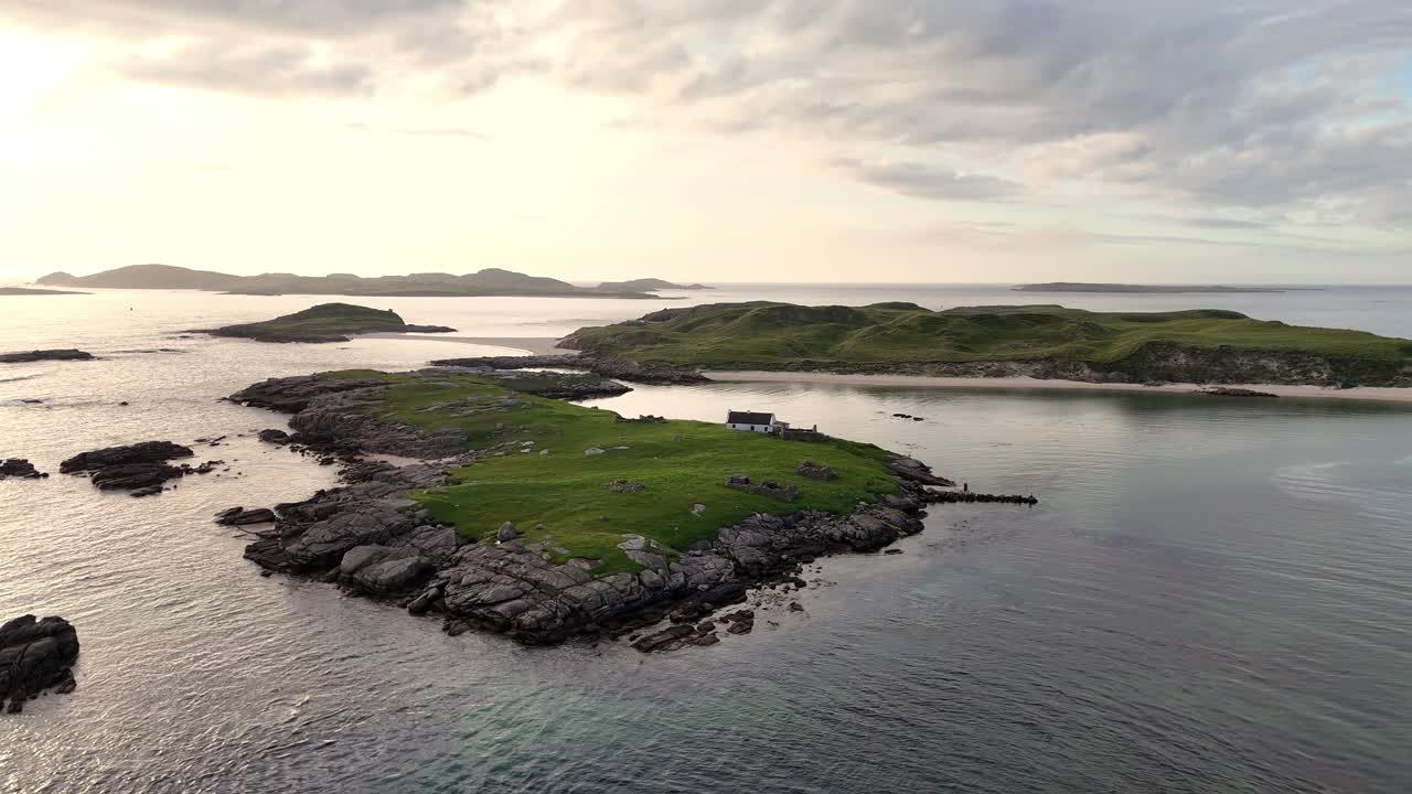 Tiny cottage on an Island off the coastline of Ireland just before sunset