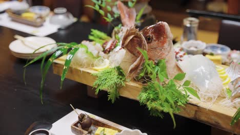 kaiseki course in japan, sea bream sashimi meal with whole fish