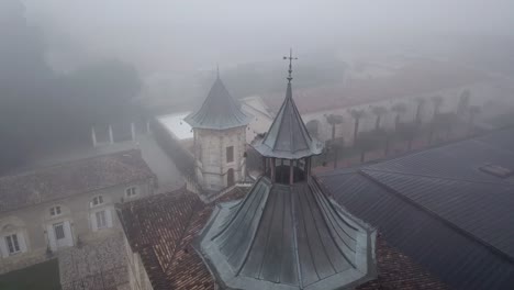 chateau cos d'estournel winery on foggy day, bordeaux region of france