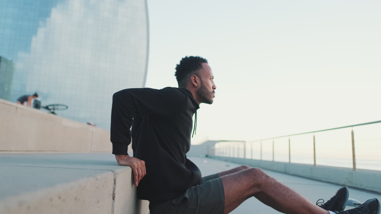 Man exercising on city steps