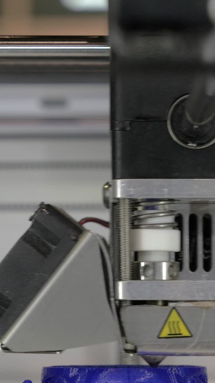 Close-up of 3D Printer Extruding Blue Plastic Filament