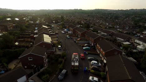 aerial view, footage of dustmen putting recycling waste into a garbage truck, bin men, refuse collectors