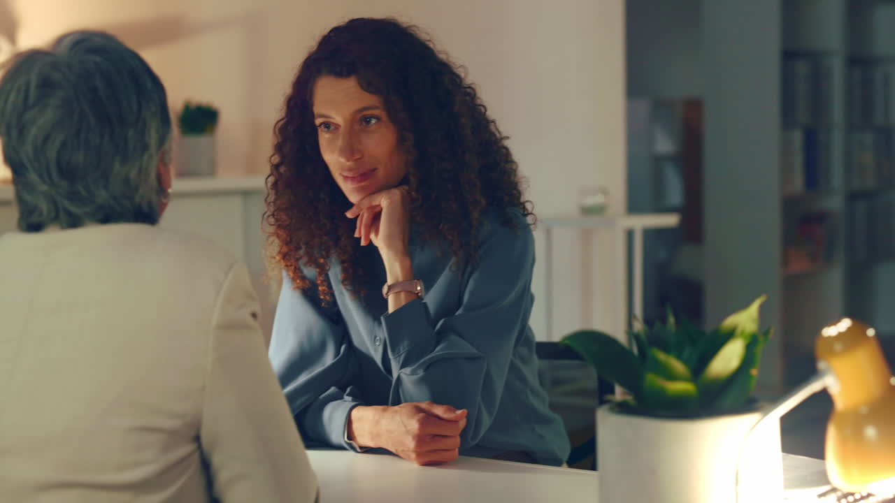 Women in Conversation at Night