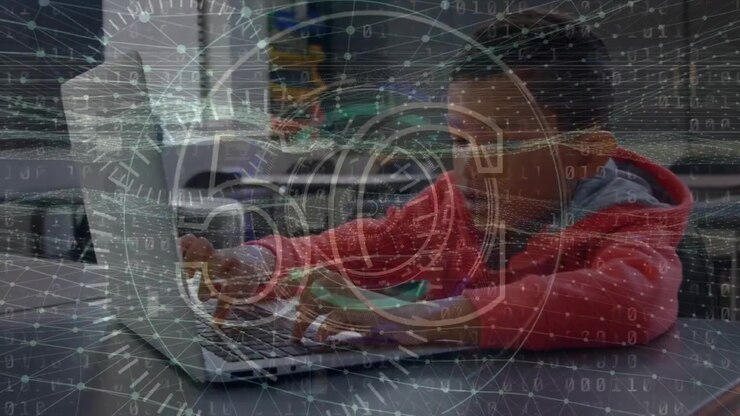 Animation of 5g text and digital wave over boy using laptop at school