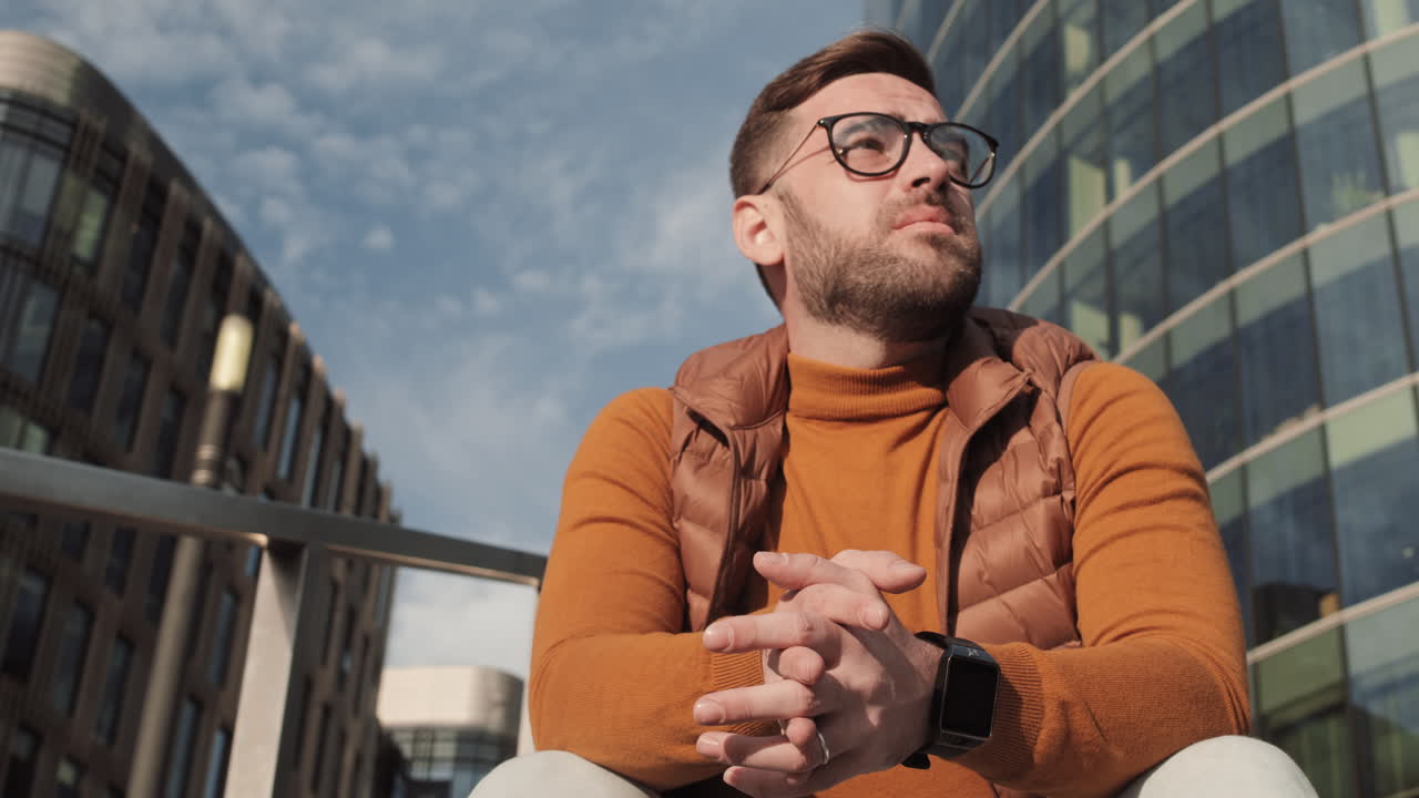 Man Taking off Glasses Outdoors