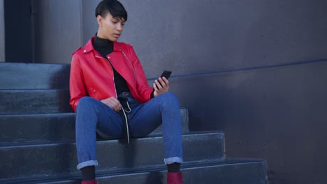 transgender adult using a phone in the street