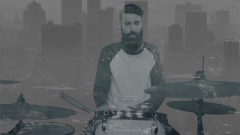 Animation-of-moving-cityscape-over-caucasian-man-playing-drums-in-black-and-white