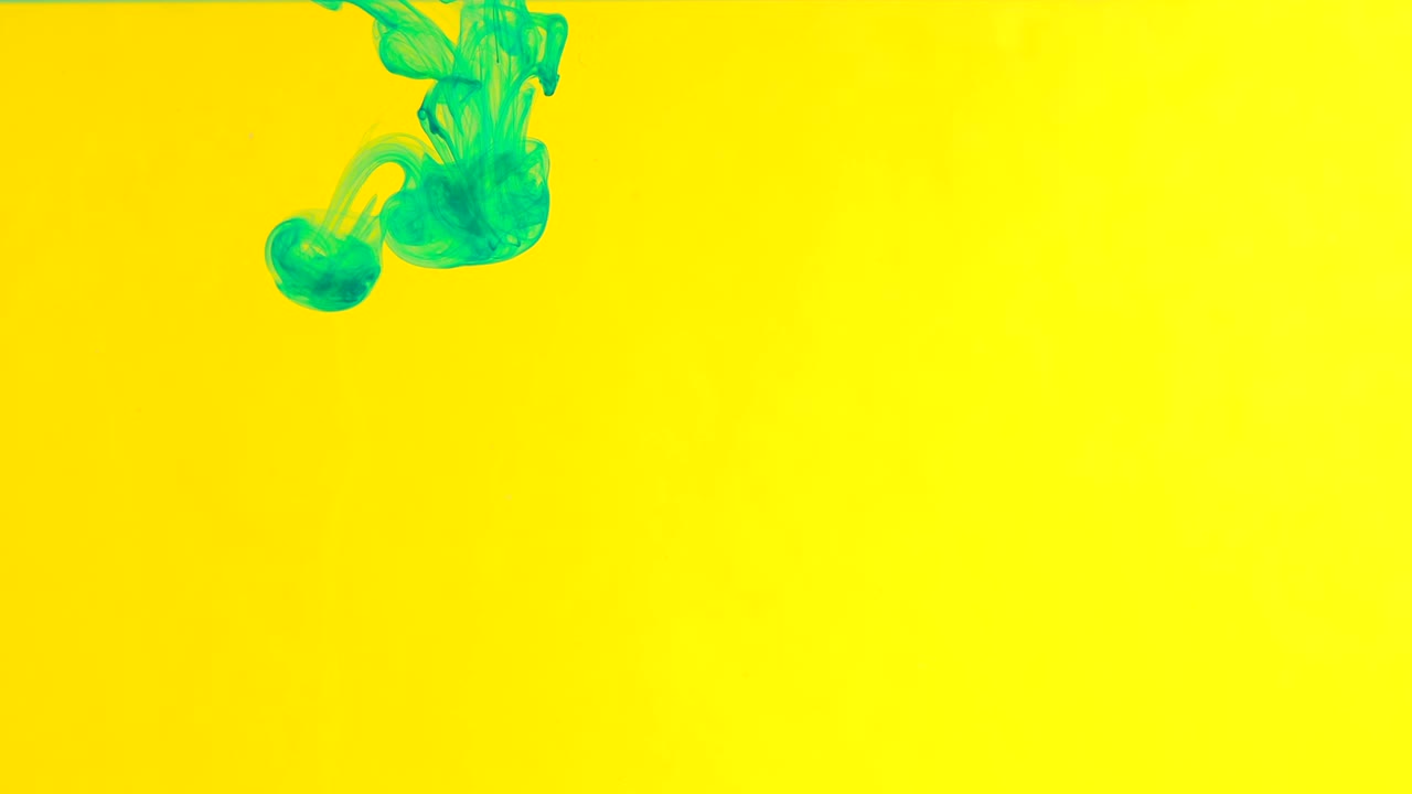 Ink in water. Green paint on yellow reacting in water creating abstract cloud formations.Can be used as transitions,added to modern grunge projects,art backgrounds, anything with creative twist