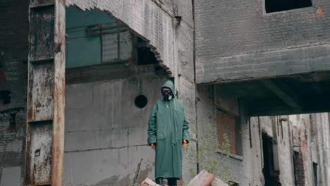 save our planet. motion camera view of the human wearing protective mask standing at the abandoned place. environmental pollution, ecological disaster, nuclear war, post apocalypse concept