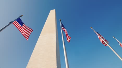 american flags and washington monument