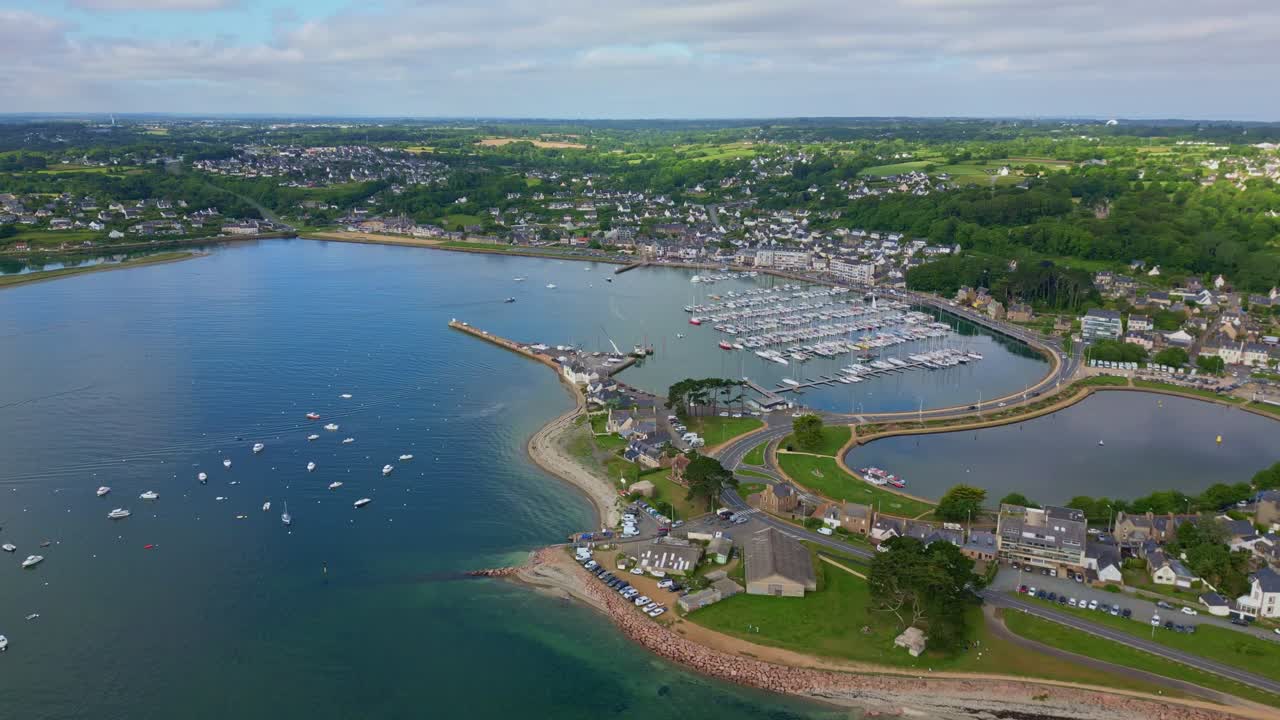 High altitude backward drone movement near the harbor of the Perros-Guirec, Brittany, France.